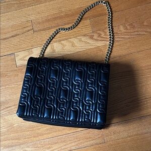 Zara Black quilted shoulder bag.